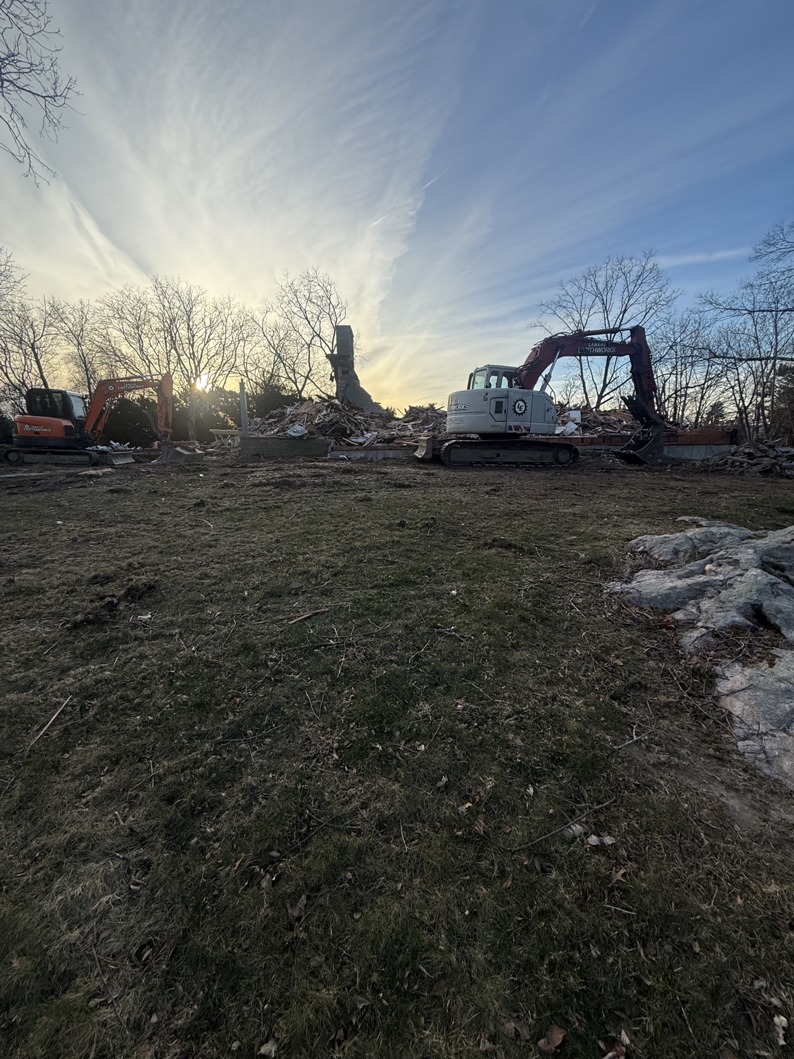 Two Lankas Earthworks excavators completing a full structure demolition