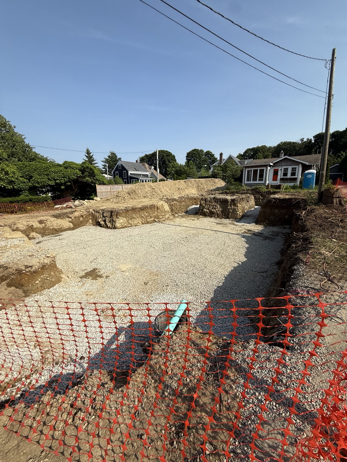 Compacted crushed stone base prepared for a new foundation